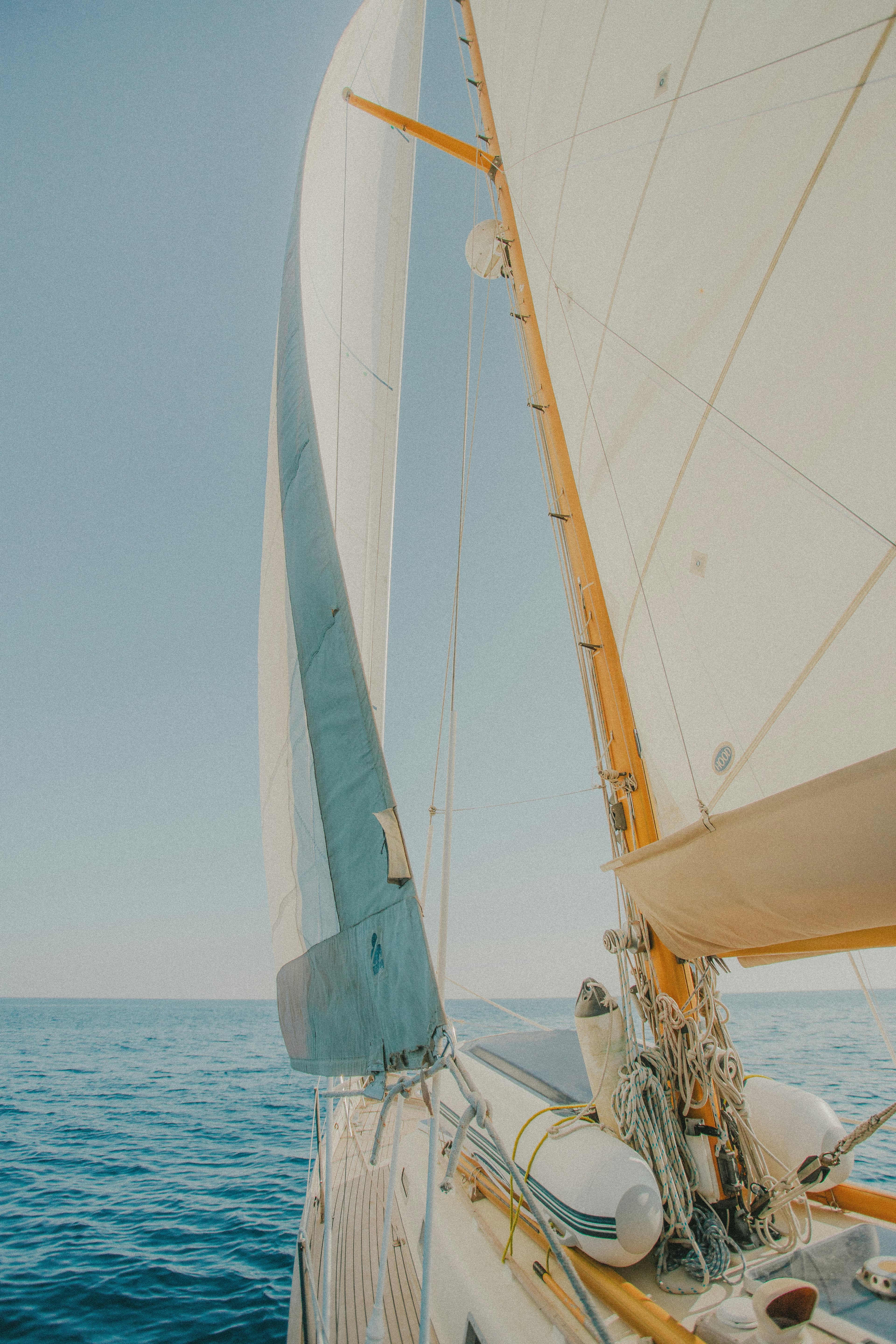Sails and rigging above the open sea
